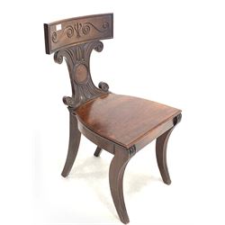 Mid 19th century Irish mahogany hall chair, the concave cresting rail with incised carved scrolls over cartouche shaped back rest, single panel seat, raised on reeded and fluted sabre supports W45cm