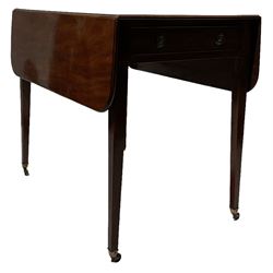 George III mahogany Pembroke table, the rectangular drop-leaf top with rounded corners, fitted with one real and one false drawer with brass handles, raised on square tapering legs with castors