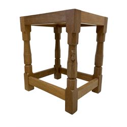 Mouseman - oak stool, tan leather upholstered seat with studded band, on octagonal supports joined by plain stretchers, carved with mouse signature, by the workshop of Robert Thompson, Kilburn