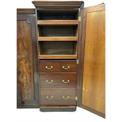 Victorian mahogany breakfront triple wardrobe, the projecting cornice over one central mirror and two doors, opening to reveal interior fitted for hanging raised on castors 