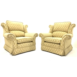 Pair armchairs upholstered in gold diamond fabric, with loose cushions, raised on castors, w93cm