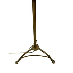 Late 19th century brass standard lamp, central cylindrical column with tripod base terminating in hairy paw feet