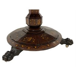 Mid-19th century Irish Killarney yew and arbutus wood breakfast table, the shaped tilt-top decorated with inlaid panels depicting various Killarney scenes including, Old Weir Bridge, Ross Castle and houses; decorated with foliage inlays and banding, octagonal faceted baluster pedestal on circular platform, inlaid with shamrocks and Celtic harps, three projecting carved paw feet with brass and ceramic castors