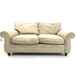 Contemporary two seat sofa, with loose cushions, upholstered in natural linen, raised on turned front supports W174cm