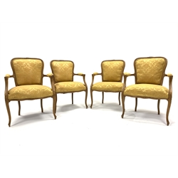 Set four French beech open armchairs, the exposed moulded frame decorated with floral carvings, arm rests, seat and back panel upholstered in yellow damask, raised on cabriole supports,   W60cm