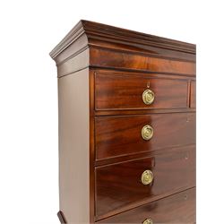 George III mahogany chest-on-chest, projecting cornice over banded frieze, fitted with two short over six long oak lined drawers, the cock-beaded facias with pressed brass plates and ring handles, lower moulded edge over bracket feet