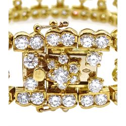 18ct gold round brilliant cut diamond bracelet, thirteen flower motifs, and diamond surround, hallmarked, total diamond weight approx 18.00 carat