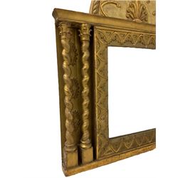 19th century gilt framed wall mirror, the demi-lune pediment carved with rope-twist border surrounding arches terminating in acorns and central stylised flower motif, the rectangular plate bordered with garland decorated arches, flanked by two spiral turned columns on each side with scroll leaf capitals
