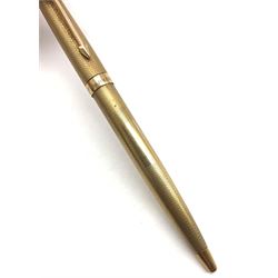 9ct gold cased Parker ballpoint pen, hallmarked for London 1974, with engine turned decoration and vacant rectangular plaque, L12.5cm, in an associated Parker case, approx. 18.86gm