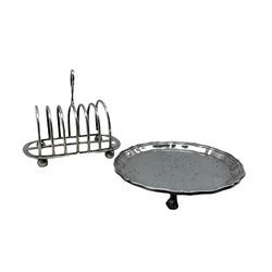 Silver circular card tray with raised border on claw and ball feet D15cm Sheffield 1964 and a silver six division toast rack with loop handle Birmingham 1903 12.7oz