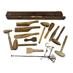 Collection of twelve lead working tools, spirit level in a wooden case and a beam balance