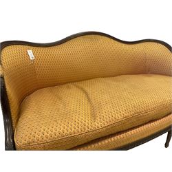Hepplewhite design mahogany framed two seat settee, the serpentine top with carved applied acanthus leaf arm terminals, upholstered in floral patterned yellow gold fabric with sprung seat, the bow-front with reeded frieze rail, raised on turned and fluted supports