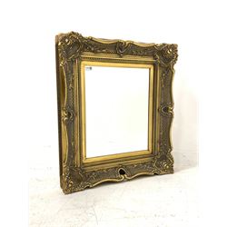 Ornate gilt frame mirror, the projecting frame decorated with foliage surrounding bevelled mirror 78cm x 80cm