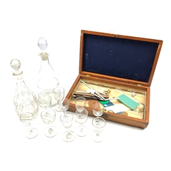 Georgian tapered decanter with slice cut neck, the body with diamond cut band and faceted stopper H35cm, another decanter, assorted 19th century clear glass drinking glasses and a Victorian mahogany work box 