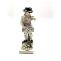 19th century Staffordshire pearlware figure of a gentleman wearing a black broad rimmed hat, pair of Staffordshire Spaniels with sponged decoration, pair of Continental porcelain candlesticks etc 