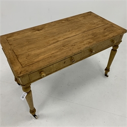  Victorian scumbled pine kitchen table, with two frieze drawers raised on turned supports and ceramic castors, W119cm x 59cm, H76cm  