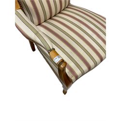 Beech framed armchair, with scrolled arms and upholstered in stripe fabric, raised on cabriole supports 