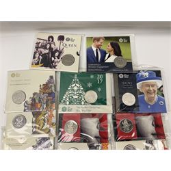 Seventeen The Royal Mint United Kingdom brilliant uncirculated five pound coins, each housed on card