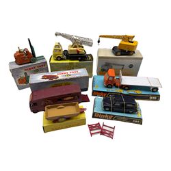 Seven Diecast model vehicles by Dinky Toys comprising Coventry climax fork lift truck 401, horse box 981, harvest trailer 320, Jones fleetmaster cantilever crane 970, London taxi 284, A.E.C. with flat trailer and Dinky Supertoys Coles mobile crane 571, mostly boxed