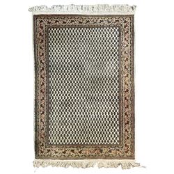 Indian woollen Arrak design ivory ground thick pile rug, the field decorated all-over with repeating Boteh motifs, the multi-band border with stylised geometric designs