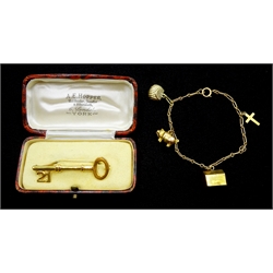 9ct gold 21 key brooch, Chester 1951, retailed by A.E. Hopper York, boxed and a gold bracelet with gold pig, bag and dog house charms, approx 7.6gm
