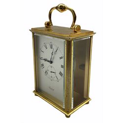 A 20th century Swiss carriage clock with a 15 jewel Imhof movement, lever escapement, integral winding key, wound and set from the rear, silver effect dial with roman numerals, five-minute Arabic’s and a subsidiary second’s dial, with beveled glass panels to the front and sides.          