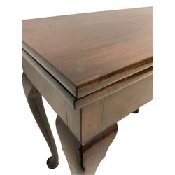 George III mahogany tea table, rectangular fold-over top supported by gate-leg action, fitted with single central drawer, raised on cabriole supports with pad feet