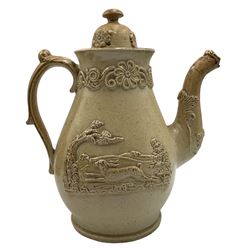 19th century Brampton salt glaze stoneware teapot, with moulded and applied decoration of a Pheasant and Hare H23cm, 19th century salt glaze tobacco jar with matched cover, S. & H. Briddon, Brampton brown salt glazed stoneware fluted bachelors teapot and cover, together with a treacle glaze sash window rest in the form of a Lions Head (4)