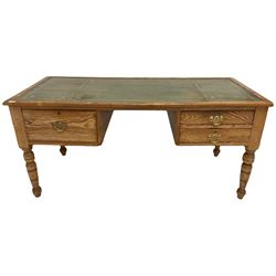 19th century pine kneehole writing desk, the rectangular top with inset green leather surface, fitted with three drawers, on turned supports