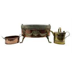 Regency design brass and copper oval planter with pierced gallery edge on paw feet W49cm, small copper two handled oval  pan engraved with a monogram and a brass hot water can (3)