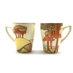 Pair of Newport Pottery Clarice Cliff Bizarre Lynton shape cups decorated in the Coral Firs design H7cm 