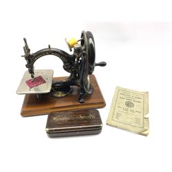 Wilcox & Gibbs 'Automatic' silent sewing machine, the chromed plate stamped Wilcox & Gibbs Sewing Machine Company, New York London & Paris, with instructions and some accessories in original tin case
