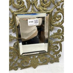 Victorian wall mirror with bevelled plate in a pierced brass frame with foliage and mask finial 39cm x 26cm overall