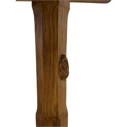 Rabbitman - oak dining table, rectangular adzed top with rounded corners, twin octagonal pillar supports on sledge feet joined by floor stretcher, carved with rabbit signature, by Peter Heap of Wetwang 