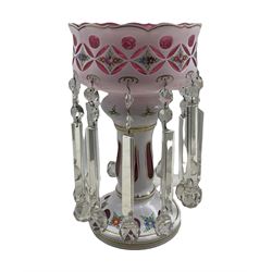 Large 20th century large glass lustre, cranberry with white overlay, bearing painted floral sprays with prismatic drops, H41cm