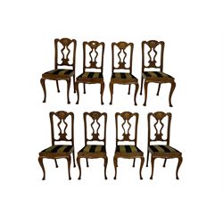 Set eight 20th century oak dining chairs, the shaped cresting rail over pierced splat, raised on cabriole supports 