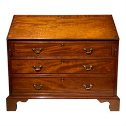 Late 19th century mahogany and mahogany banded bureau, the fall front enclosing small drawers and pigeon holes, fitted with three graduating drawers, on bracket feet