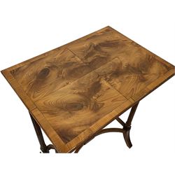 Yew wood nest of tables, the largest of rectangular form with matched figured veneer, on turned and stop fluted supports joined by plain stretchers and with splayed moulded feet, two smaller nesting tables with  curved x-framed stretchers 