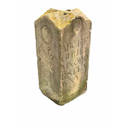 'The art of the Stonemason' - A York stone totem, with vaulted top over square body carved with masks, two alphabets in gothic serif font, gothic arches and Celtic spiral design. This was probably made as an advertisement to show of the skill of a Stonemason, or as an apprentice piece for similar reasons. 