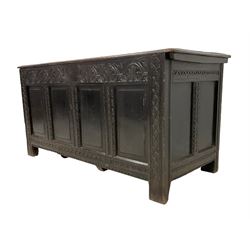 18th century dark oak coffer or chest, rectangular hinged lid with moulded edge, the frieze carved with lunettes and fleur-de-lis design, panelled front and sides with fluted uprights with carvings