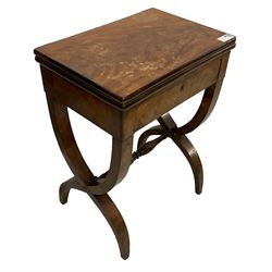 Charles X mahogany tea table, rectangular fold-over and swivel top with oval baize lined interior and moulded edge, fitted with single drawer, raised on a curved X-frame base united by a swell and ring turned stretcher
Provenance: From the Estate of the late Dowager Lady St Oswald