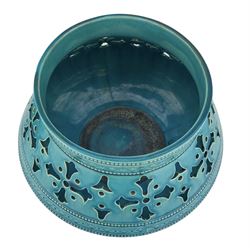 Burmantofts Faience turquoise-glaze jardiniere of Persian influence, rounded base with inverted sides and flattened rim, flowerhead pierced band, enclosed within beaded borders and incised geometric decoration, impressed factory marks beneath, model no. 489, H18cm