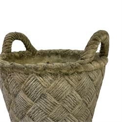 Cast stone garden planted in the form of a weaved basket with carrying handles