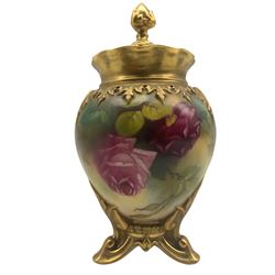 Early 20th century Royal Worcester pot pourri vase and cover, ovoid form body with pierced cover and floral finial, hand painted with roses, unsigned, upon three splayed suppots, puce printed marks beneath including shape number 245 and date code for 1917, H19cm