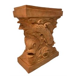 Regency design terracotta finish pedestal, modelled as two intertwined dolphins and decorated with shells, stepped rectangular top and plinth base