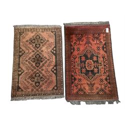 Two small Persian ground rugs, both with central medallions and floral motifs 