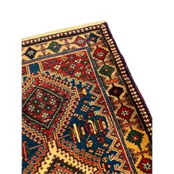 Persian Hamadan blue ground runner, nine interconnected lozenge medallions surrounded by small stylised floral motifs, the guarded border decorated with linked and trailing geometric pattern