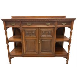 Late Victorian walnut buffet sideboard, raised back, the gadroon moulded top over three pine lined drawers, shelves and double cupboard, the cupboard enclosed by panelled doors with carved foliate and cartouche decoration