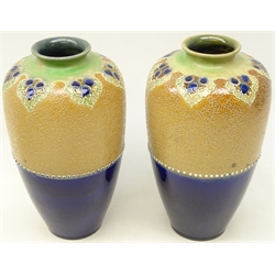  Pair Royal Doulton stoneware vases of baluster form with half glazed body and chine ware decoration below tube lined leafage, possibly by W. Baron, H24cm  