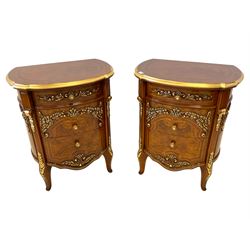 Barnini Oseo - pair French design 'Reggenza' elm bedside tables, demi-lune top with mahogany banding, fitted with three graduating drawers, the facias moulded with gilt scrolled foliate decoration, raised on cabriole supports
